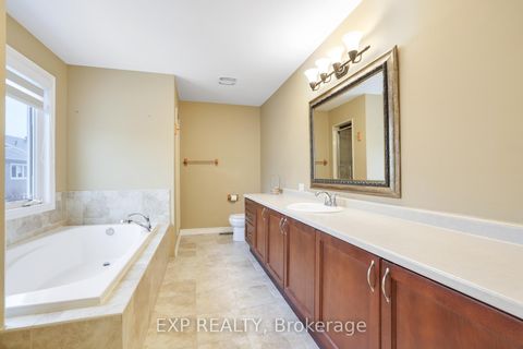 Photo 13 at 210 Rivertree Street, Emerald Meadows/Trailwest, Kanata